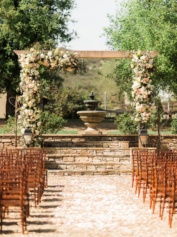  Floral arch with fountain in the background of this private venue.  Perfect for wedding and reception.